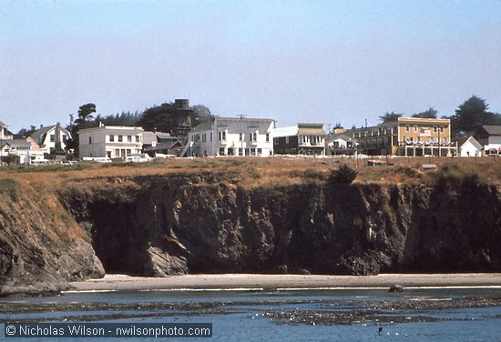 View of Mendocino on the bluffs from aboard the Phyllis Cormack anchored in Mendocino Bay.