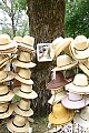 Display of hats and photographer's self-portrait