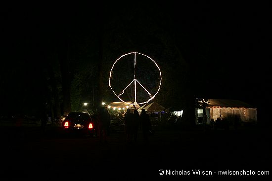 View of the lighted giant peace symbol backstage