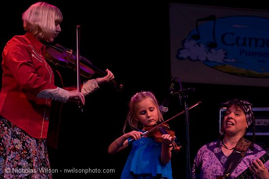 Hattie Craven on fiddle with Laura Love and Barbara Lamb
