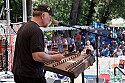 Multi-instrumentalist and singer John McCutcheon on the main stage Sunday morning playing a hammered dulcimer