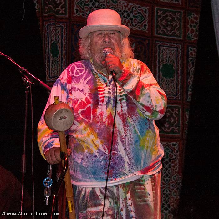 Wavy Gravy makes an announcement on the main stage.