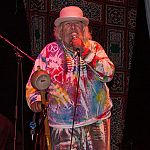 Wavy Gravy makes an announcement on the main stage.
