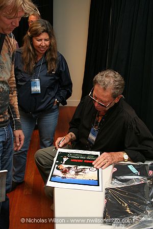 Gaffer Rich Aguilar autographs an Easy Rider poster at the inaugural Mendocino Film Festival in 2006.