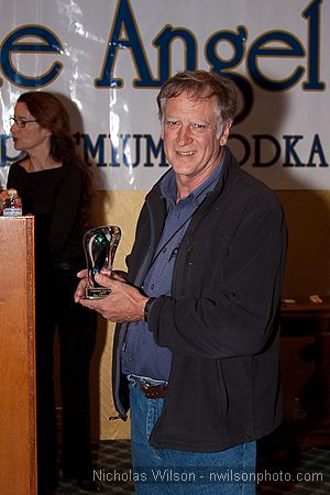 Filmmaker Alan Dater receives the Award for Best Documentary for his
        film "Taking Root."