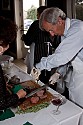 Mendocino Hotel owner Dr. Tom Kravis carves beef at the festival opening party.