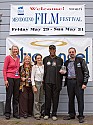Danny Glover outside Crown Hall with Mendocino Film Festival organizers  Ann Walker, Pat Ferrero, Betsy Ford and Keith Brandman, who holds Glover's special Wave of Change Award trophy.