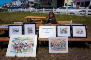 Artist Patricia Martin Osborne displays some of her Mendocino Music Festival inspired watercolors in outside the festival tent Thursday morning.