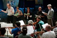 In rehearsal for the grand finale concert of the Mendocino Music Festival 2011, maestro Allan Pollack conducts the orchestra; vocal soloists are Erin Neff, Carrie Hennesey, David Gustafson and Matthew Miksak.