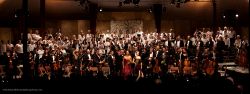 Panoramic view of the full orchestra, vocal soloists and chorus  as everyone stands to acknowledge the standing ovation, a glorious ending to the 25th season of the Mendocino Music Festival.