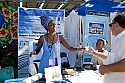 A graceful hostess gives a purified water sample at SolFest 2007