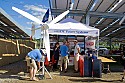 DC Power Systems showed a wind turbine and solar panels at SolFest 2007. Note the huge solar electric array overhead that provides power for Real Goods and shades the parking lot.