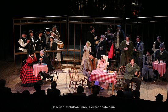 The scene at Cafe Momus with all of the principals and some of the chorus in Act II of Opera Fresca's April 2006 production of Puccini's La Boheme.