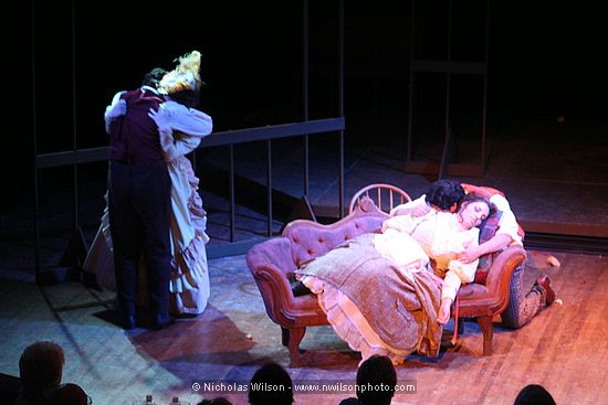 Marcello and Musetta comfort each other as Rodolfo mourns his Mimi.