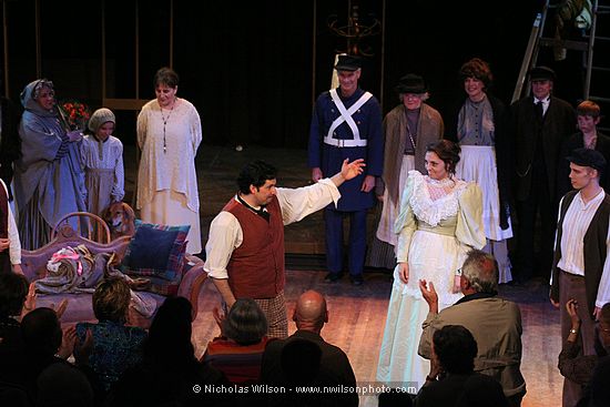 Pedro Rodelas (Rodolfo), Jessica Julin (Mimi), Bryan Boyce (Colline) and members of the chorus take their bows.