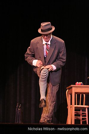 Bill Irwin does a quick costume change on stage at Cotton Auditorium, Fort Bragg CA