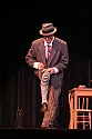 Bill Irwin does a quick costume change on stage at Cotton Auditorium, Fort Bragg CA