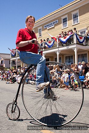 Tony Graham rides his penny farthing bicycle.