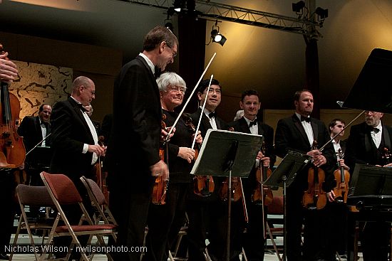 Festival orchestra members receive applause following Brahms' Symphony No. 4.